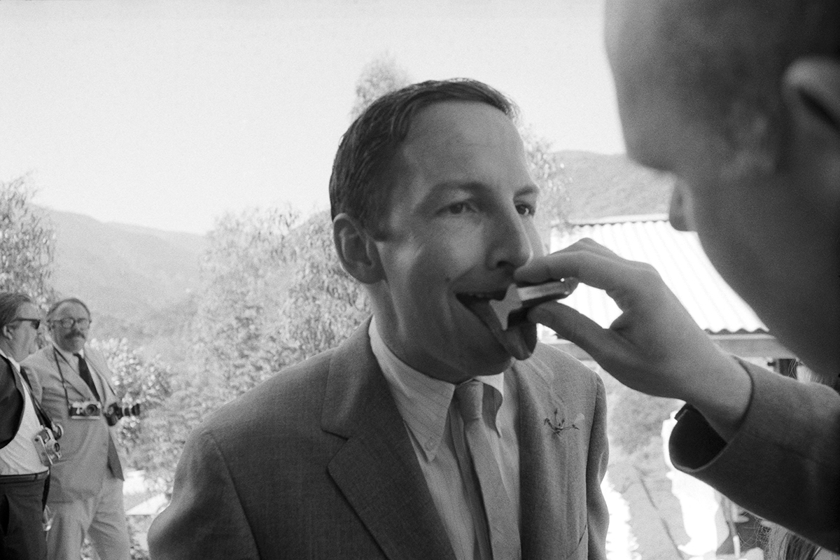 Robert Rauschenberg (getting tongue stamped by Claes Oldenburg). 1966